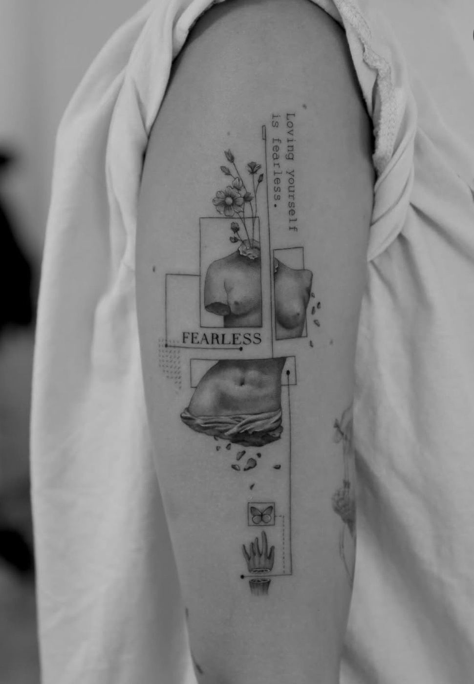 Fragments of a classical torso with flowers and fine rectangles, the word FEARLESS and the line: Loving yourself is fearless.